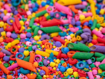 Rainbow Explosion Sensory Filler Mix with colorful rice pasta chickpeas and pearls