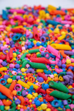 Rainbow Explosion Sensory Filler Mix with colorful rice pasta chickpeas and pearls
