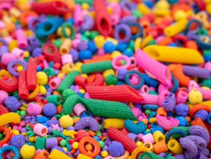 Rainbow Explosion Sensory Filler Mix with colorful rice pasta chickpeas and pearls