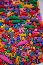 Rainbow Explosion Sensory Filler Mix with colorful rice pasta chickpeas and pearls