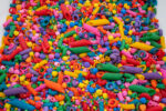 Rainbow Explosion Sensory Filler Mix with colorful rice pasta chickpeas and pearls