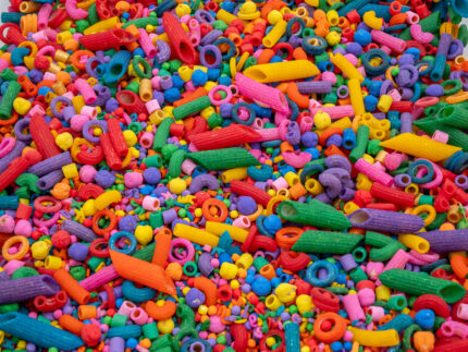 Rainbow Explosion Sensory Filler Mix with colorful rice pasta chickpeas and pearls