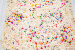 Alphabet Cloud Dough with colorful letter pieces for sensory play