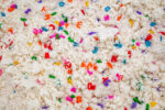Alphabet Cloud Dough with colorful letter pieces for sensory play