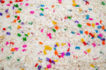 Alphabet Cloud Dough with colorful letter pieces for sensory play