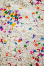 Alphabet Cloud Dough with colorful letter pieces for sensory play