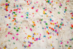 Alphabet Cloud Dough with colorful letter pieces for sensory play