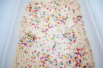 Alphabet Cloud Dough with colorful letter pieces for sensory play