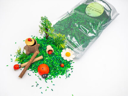 Ladybug Budget Bag with green grass rice wooden ladybugs logs and garden accessories