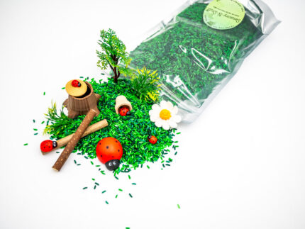 Ladybug Budget Bag with green grass rice wooden ladybugs logs and garden accessories