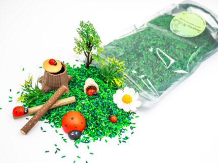 Ladybug Budget Bag with green grass rice wooden ladybugs logs and garden accessories