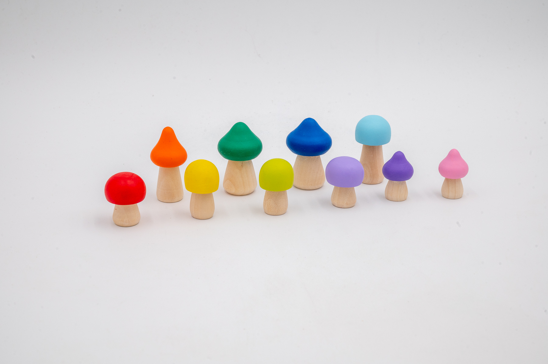 Assorted Primary Rainbow Mushrooms Set of 10-3 Assorted Rainbow Wooden Mushrooms set of 10 hand-painted mushrooms in bright rainbow colors and mixed shapes for sensory and small-world play