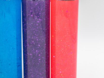 Six glitter calming bottles in pink, orange, yellow, green, blue, and purple with sparkly glitter