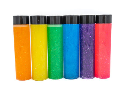 Six glitter calming bottles in pink, orange, yellow, green, blue, and purple with sparkly glitter
