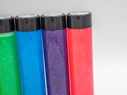 Six glitter calming bottles in pink, orange, yellow, green, blue, and purple with sparkly glitter