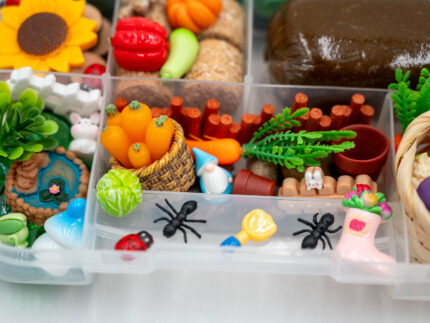 Deluxe Gardening Play-Doh Kit with colorful dough and miniature vegetables, flowers, plants, garden accessories, basket, and nature-themed pieces