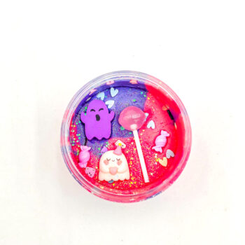 Four Halloween playdough jars with glitter and ghost, bat, cauldron, and haunted house charms