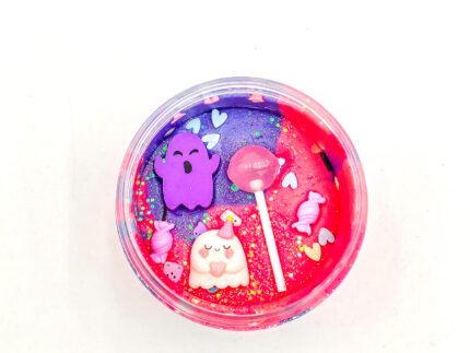 Four Halloween playdough jars with glitter and ghost, bat, cauldron, and haunted house charms