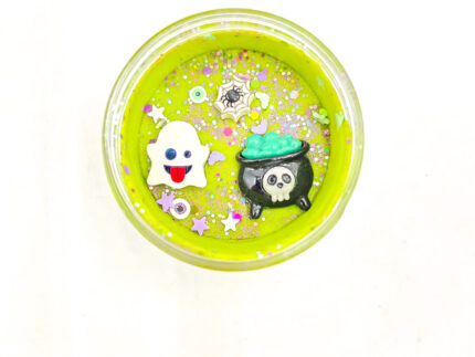 Four Halloween playdough jars with glitter and ghost, bat, cauldron, and haunted house charms