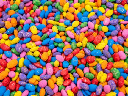 Rainbow Beans Sensory Filler with red, orange, yellow, green, blue, pink, and natural pinto beans for colorful sensory play