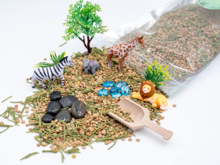 Safari Budget Bag with split peas, dyed pasta, lion, giraffe, elephant, zebra, tree, bushes, rocks, blue flat-back marbles, and wooden scoop