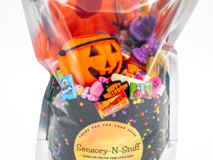 Trick-or-Treat Budget Bag with black rice, rainbow couscous, jack-o'-lantern container, pretend candy, Halloween charms, and ghost eraser