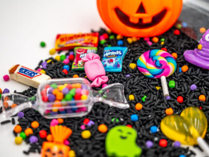 Trick-or-Treat Budget Bag with black rice, rainbow couscous, jack-o'-lantern container, pretend candy, Halloween charms, and ghost eraser