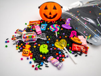 Trick-or-Treat Budget Bag with black rice, rainbow couscous, jack-o'-lantern container, pretend candy, Halloween charms, and ghost eraser