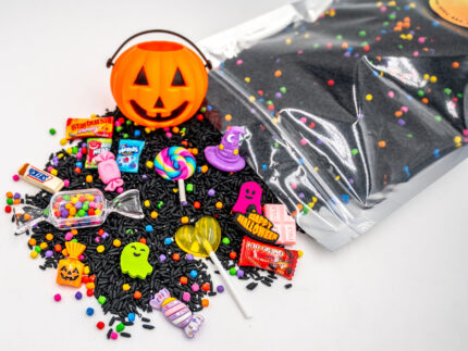 Trick-or-Treat Budget Bag with black rice, rainbow couscous, jack-o'-lantern container, pretend candy, Halloween charms, and ghost eraser